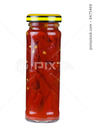 Glass jar with marinated red chili peppers Glass jar with marinated red chili peppers 8475469