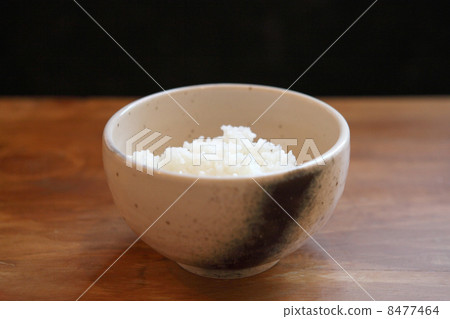 Rice with wood background Rice with wood background 8477464