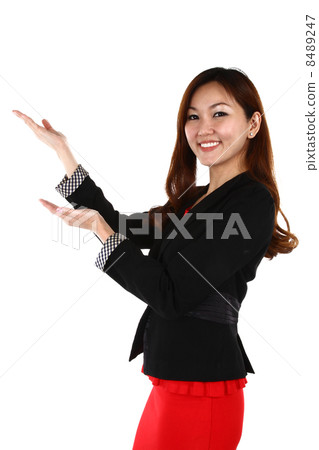 Portrait of young Asian business woman keeping finger on her lips and asking to keep quiet, on white Portrait of young Asian business woman keeping finger on her lips and asking to keep quiet, on white 8489247