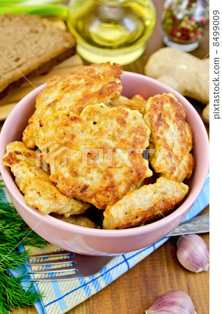 Fritters chicken with bread and spices on board 8499009