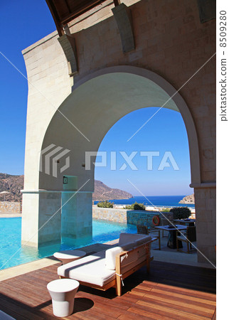Vertical view of arch pool terrace on summer resort (Greece) 8509280