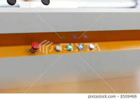 Image of glowing buttons on working loom 8509466