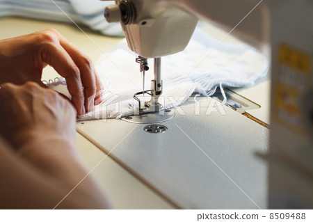 Image of seamstress working on sewing machine 8509488