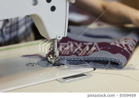 Work in sewing shop at textile factory, close-up Work in sewing shop at textile factory, close-up 8509489