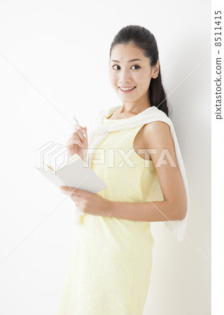 A woman watching a notebook A woman watching a notebook 8511415