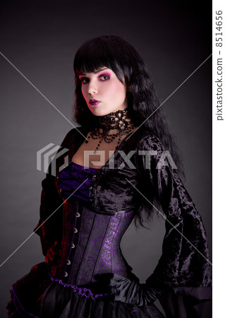 Portrait of attractive gothic girl in elegant medieval costume 8514656