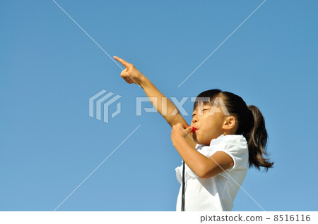 A girl playing a whistle 8516116