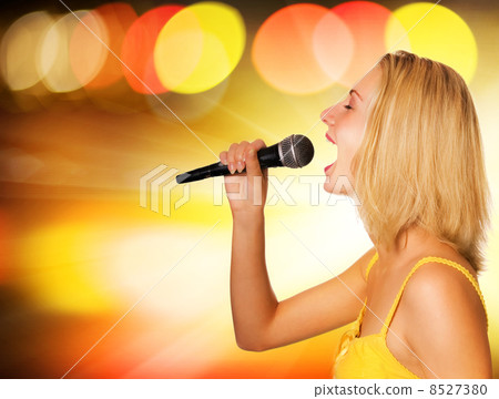 Beautiful young singer on abstract background Beautiful young singer on abstract background 8527380