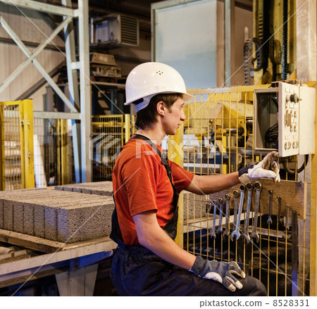Factory worker fixing broken device Factory worker fixing broken device 8528331