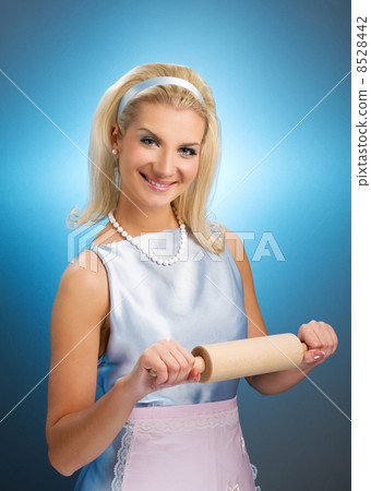 Happy housewife with rolling pin 8528442