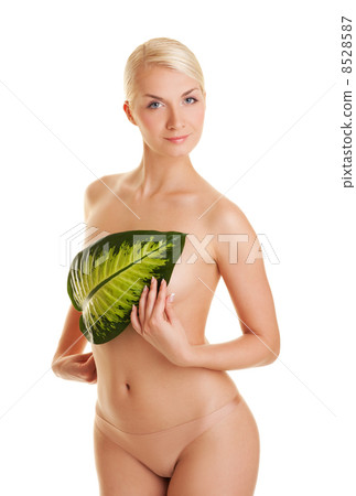 Beautiful young woman with exotic green leaf. Isolated on white 8528587