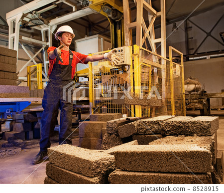 Factory worker throwing defective block Factory worker throwing defective block 8528915