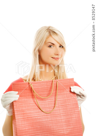 Beautiful young woman with a bag. Isolated on white background 8529147