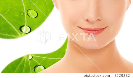 Beautiful young woman ove green leaf background Beautiful young woman ove green leaf background 8529282