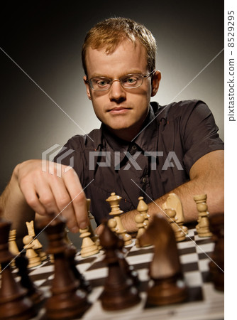 Chess master making smart move 8529295