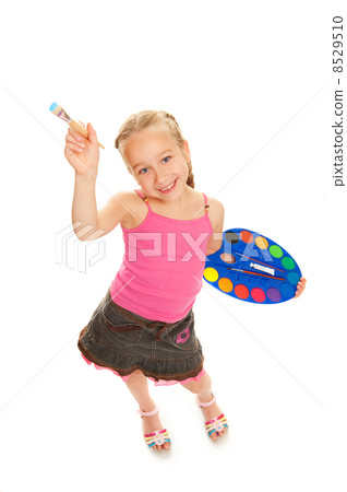 Beautiful little girl with a paintbrush, Isolated on white 8529510