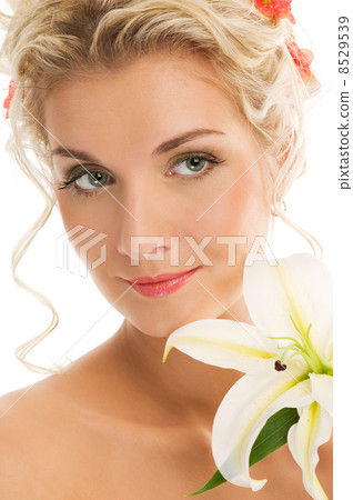 Beautiful young woman with lily flower. Close-up portrait Beautiful young woman with lily flower. Close-up portrait 8529539