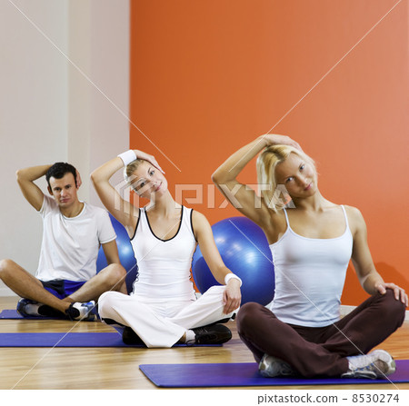 Group of people doing yoga exercise.. Group of people doing yoga exercise.. 8530274