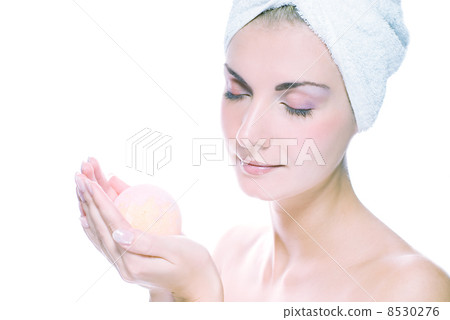 Lovely young woman with aroma bath ball in her hands. Toned in b Lovely young woman with aroma bath ball in her hands. Toned in b 8530276