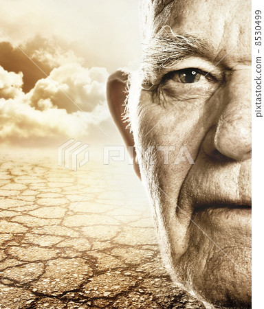 Elderly mans face over dry desert land background Elderly mans face over dry desert land background 8530499
