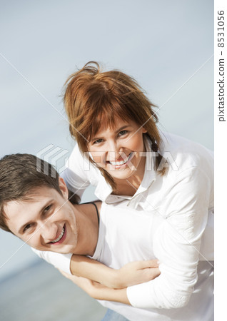 Young couple walking on the beach. 8531056