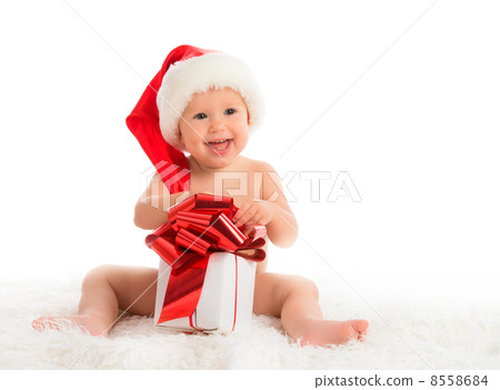 happy baby in a Christmas hat with a gift isolated 8558684
