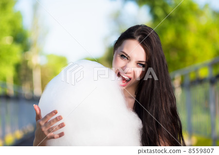 Young brunette eating Young brunette eating 8559807