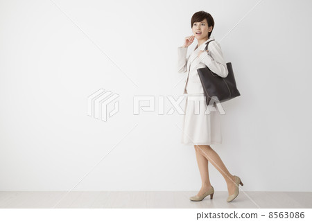 Women in beige suits 8563086