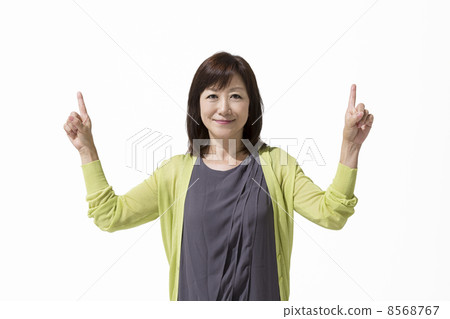 Mature female pointing to a finger Mature female pointing to a finger 8568767