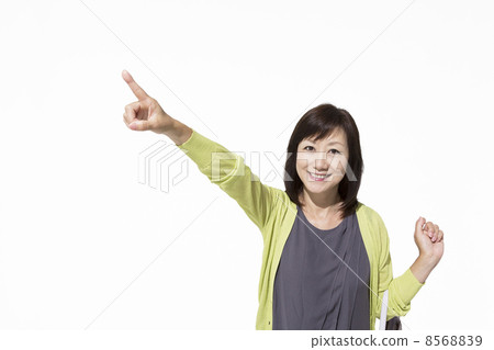 Mature female pointing to a finger 8568839