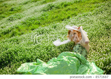 Girl resting in grass Girl resting in grass 8571687