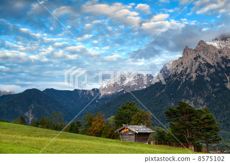 hut on meadow and Karwendel mountain range by Mittenwald 8575102