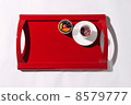 bright red tray with cupcake and tea 8579777