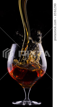 Cognac or brandy on a black 8592290
