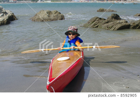A child wearing at a sea kayak for children 8592905