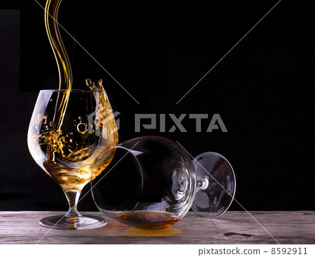 Cognac or brandy on a wooden table 8592911