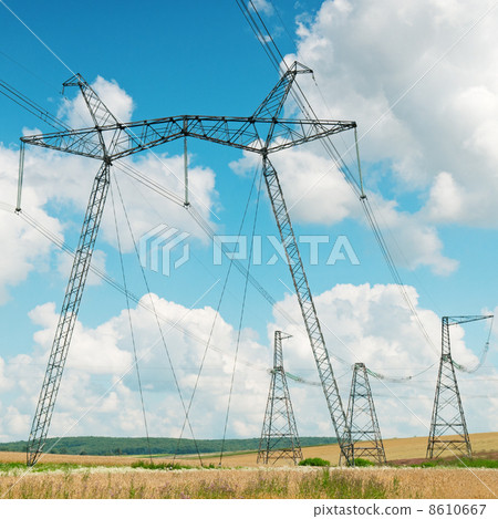 Power transmission line on a background of the cloudy sky Power transmission line on a background of the cloudy sky 8610667
