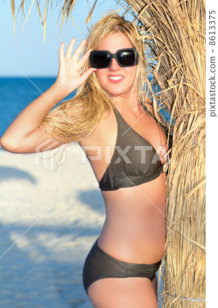 Playful blond woman Playful blond woman 8613375