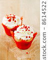 red festive muffins with heart candy and  wood 8614522