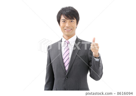 A businessman doing a thumbs up A businessman doing a thumbs up 8616094