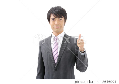 A businessman doing a thumbs up A businessman doing a thumbs up 8616095