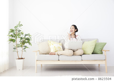 A woman relaxing in the room 8623504