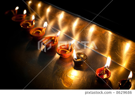 Burning oil lamps. India 8629686