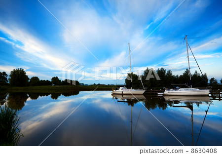 two yachts on blue river 8630408