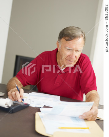 Senior man checking home finances 8633092