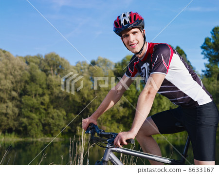 young man training on mountain bike 8633167