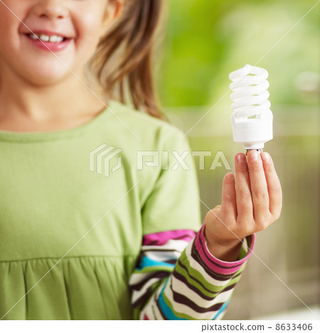 Girl holding light bulb 8633406