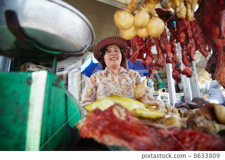 Portrait of Asian woman selling street food in Cambodia 8633809