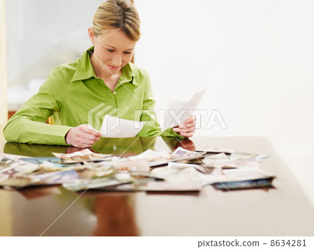 woman looking at photos 8634281