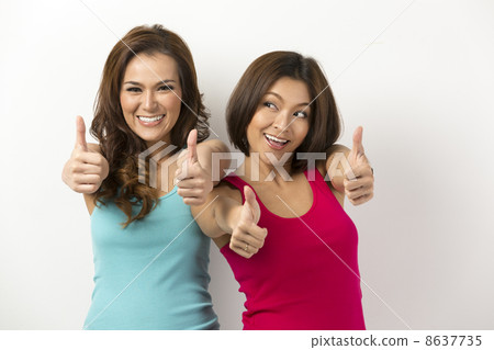 Two Asian Women with both thumbs up 8637735